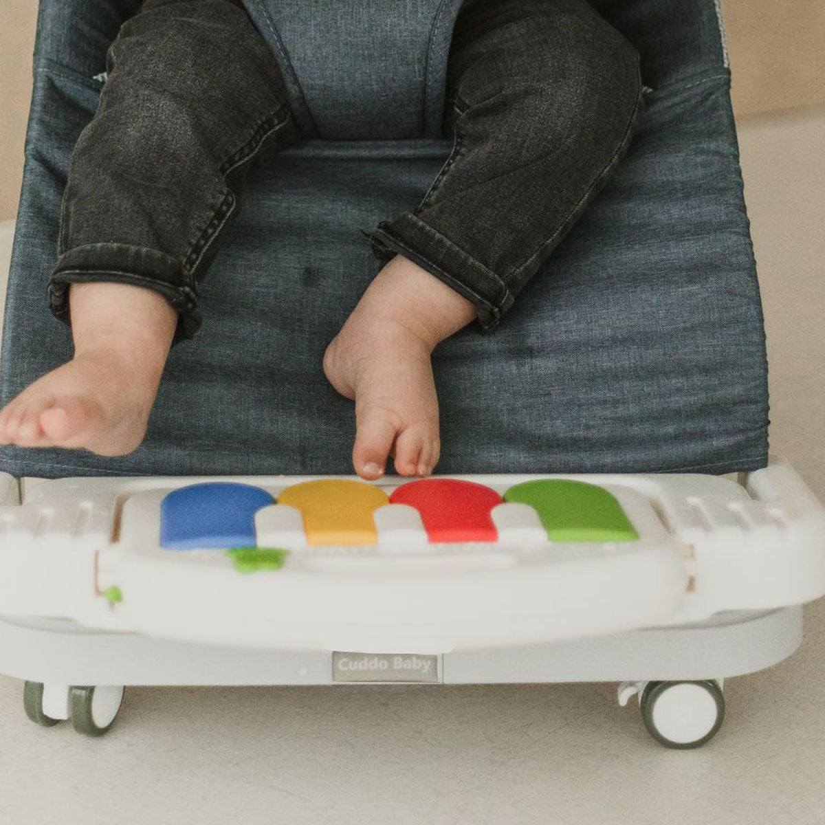 Portable 4 in 1 baby chair folded and ready to pack