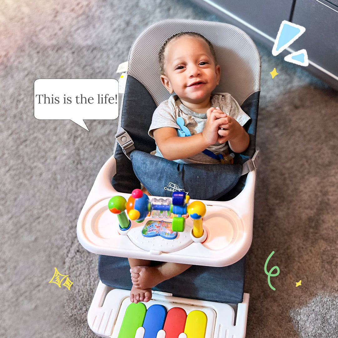 Parent carrying lightweight Cuddobaby bouncer during family trip