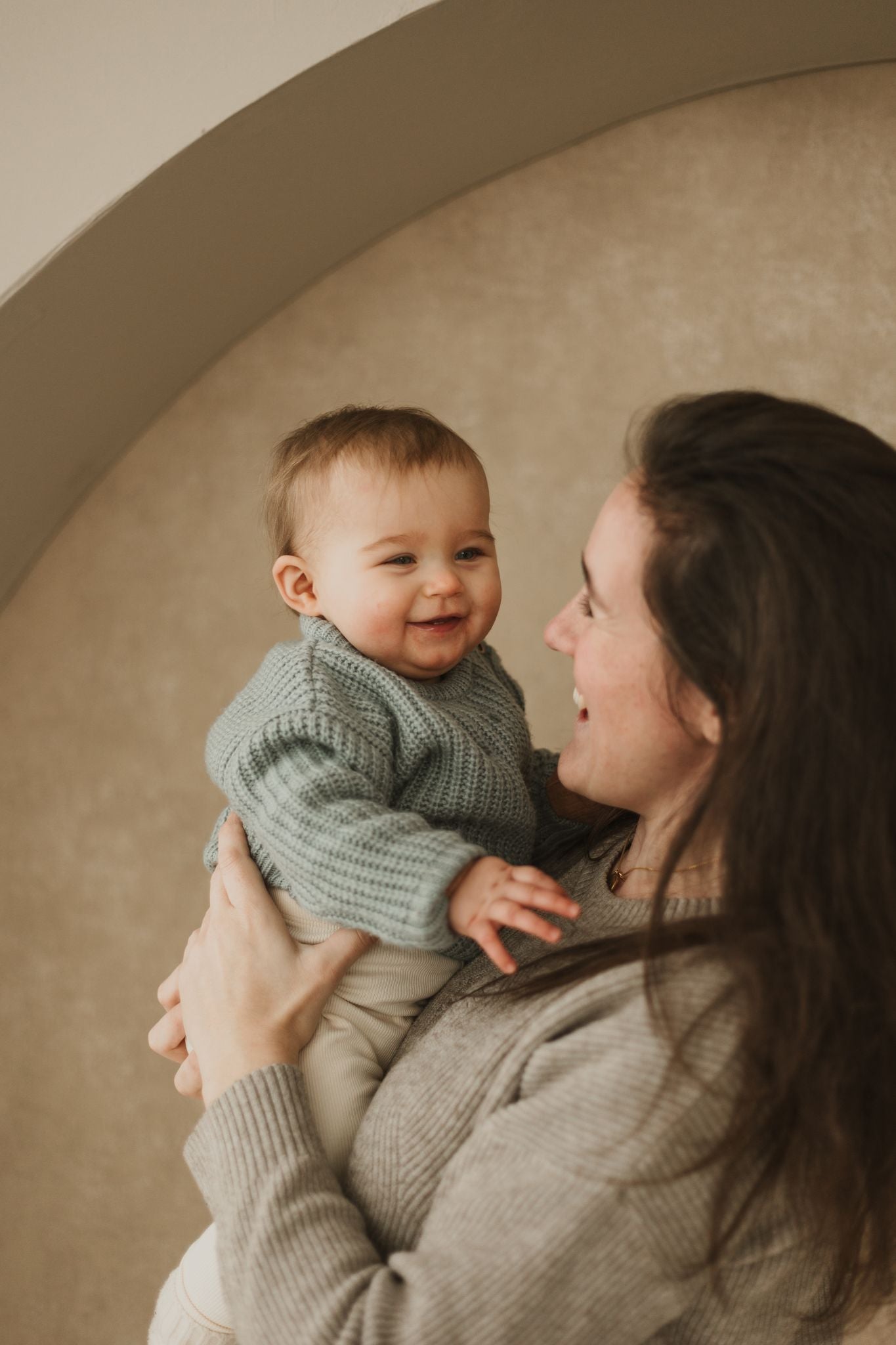 Baby observing a mobile in a calm play environment