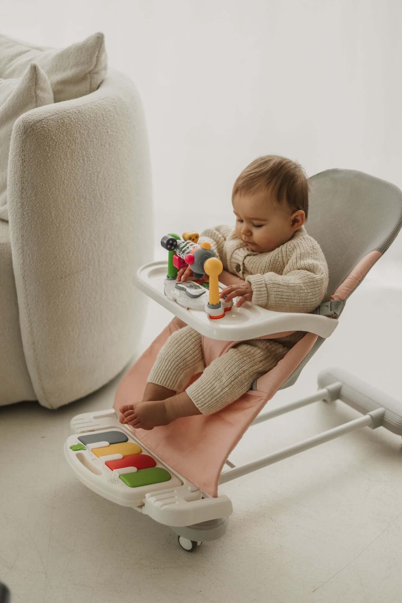 Baby Napping in Cuddobaby 4-in-1 Pink Bouncer with Safe Design